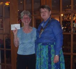 Joan being presented a donation for the RWT by Sheila 